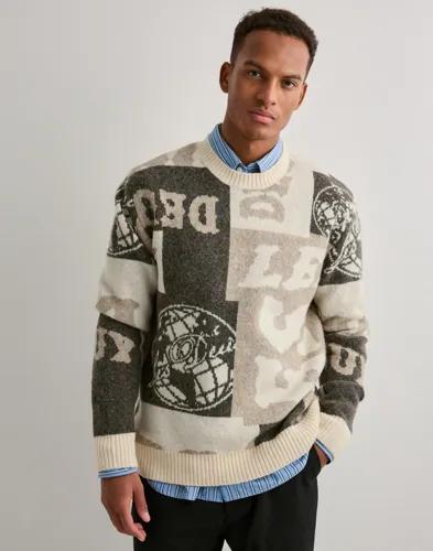 Les Deux Globe Crewneck Knit Stickade tröjor Beige