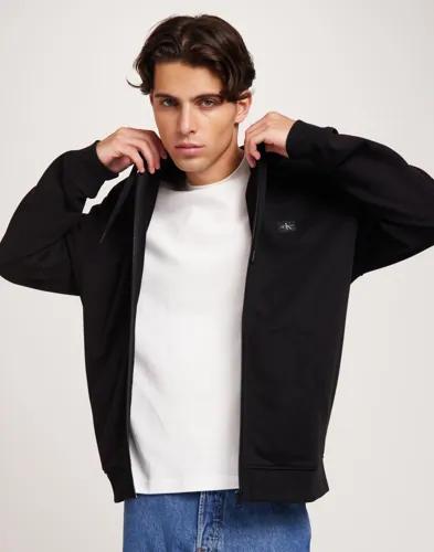 Calvin Klein Jeans Woven Label Zip Through Hoodie Hoodies med dragkedja Svart 