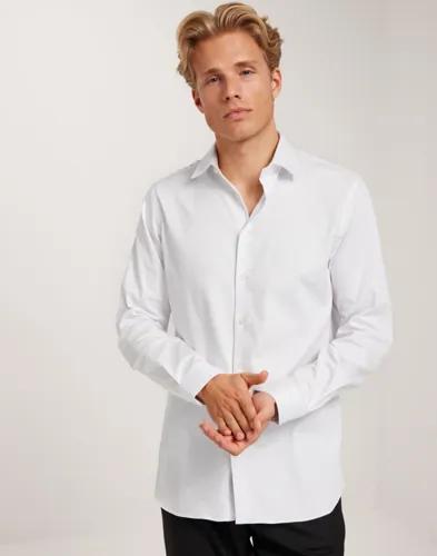 Selected Men Slhslim-Performance Shirt Ls Noos Enfärgade skjortor Vit 