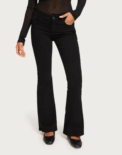 Se topplista för Jeans