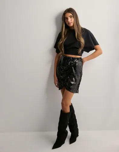 Se topplista för Kjolar