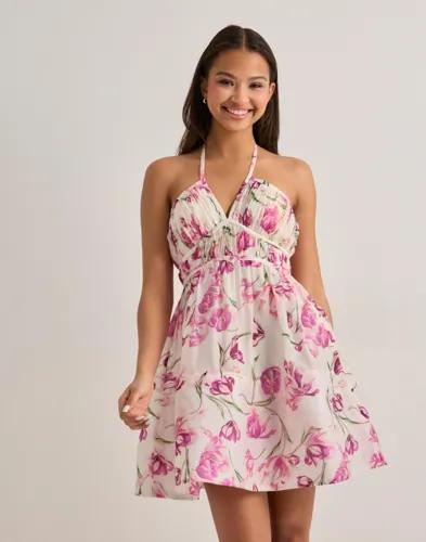 Se topplista för Klänningar