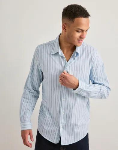 Se topplista för Skjortor