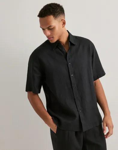 Se topplista för Skjortor