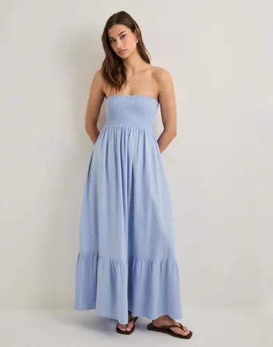 Se topplista för Klänningar