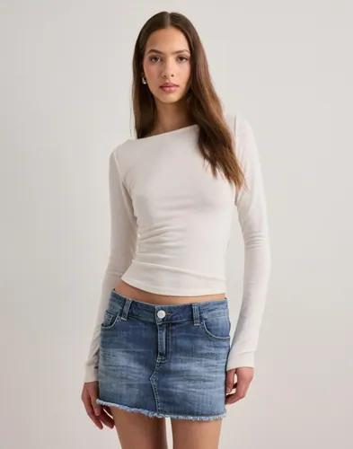 Se topplista för Kjolar