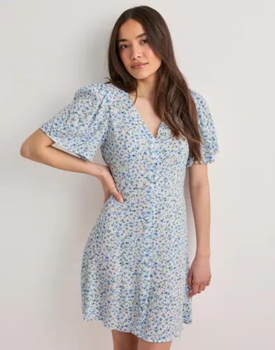 Se topplista för Klänningar