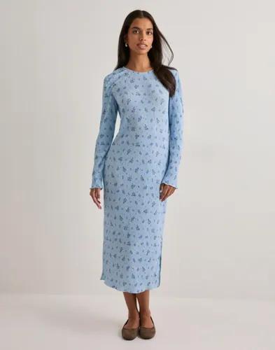 Se topplista för Klänningar