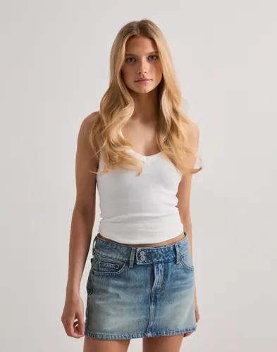 Se topplista för Kjolar