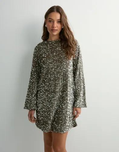 Se topplista för Klänningar