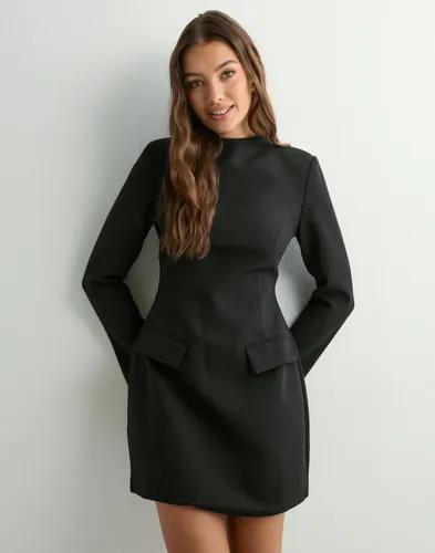 Se topplista för Klänningar